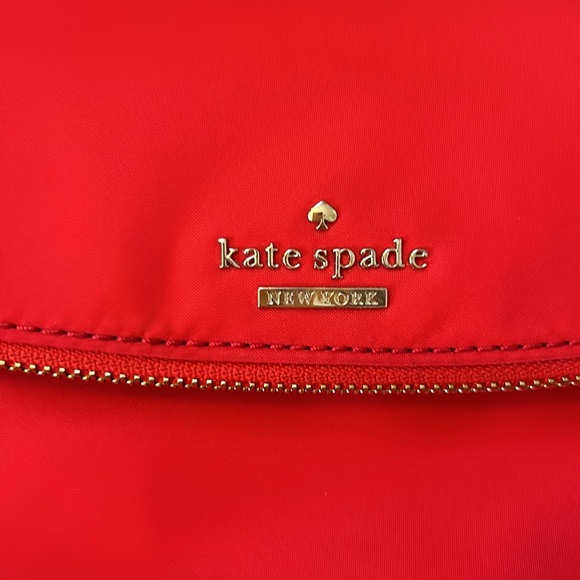 Kate Spade Red cross body purse. Fold over flap style. Zip pocket on front. - Picture 3 of 14